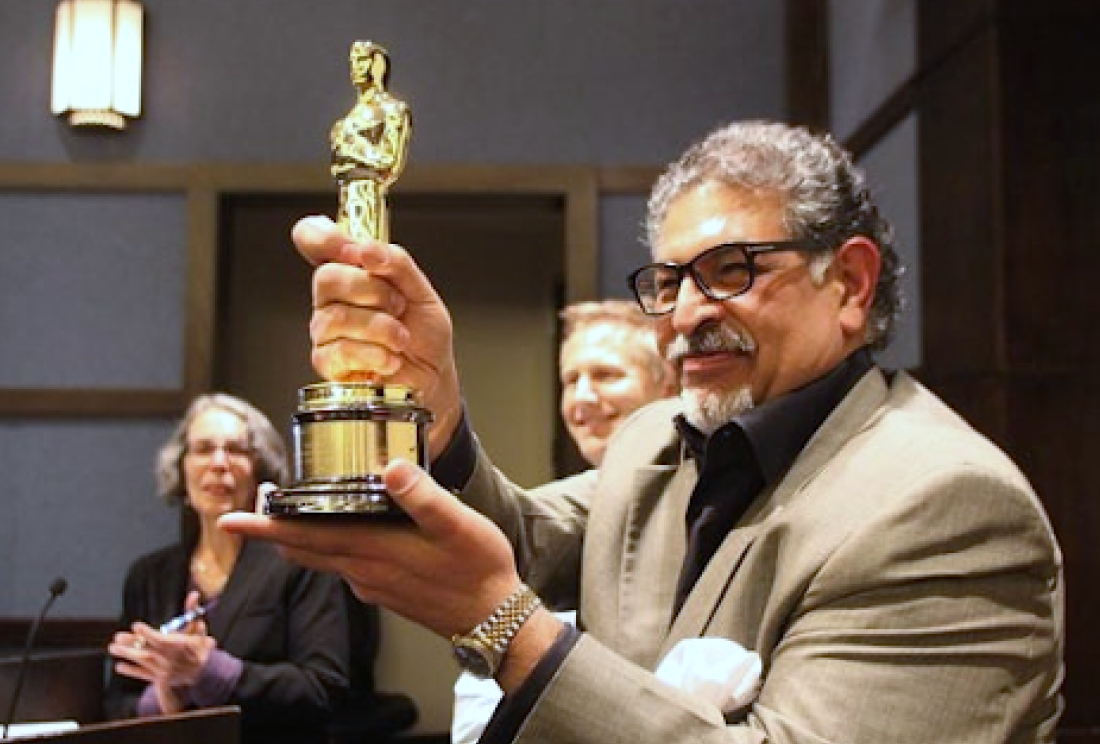 Image of Dr. Rawad receiving the oscar for Oscar-Winning  Documentary Saving Face A Campaign for Change 